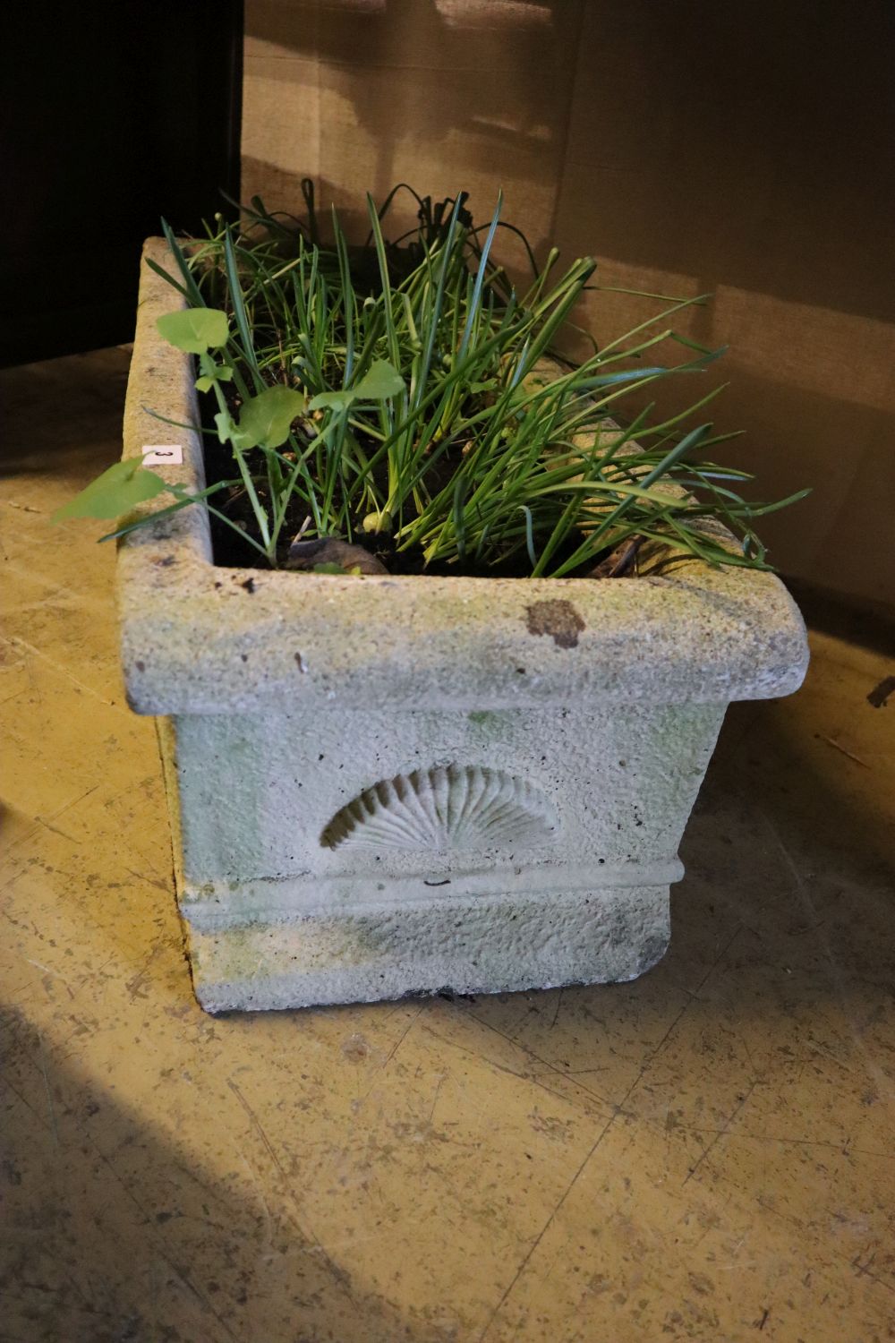 A rectangular reconstituted stone garden planter, width 90cm, depth 33cm height 27cm